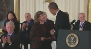 Linnea Smith, Dean Smith's wife, accepts the Presidential Medal of Freedom at a White House ceremony. (Photo from whitehouse.gov)