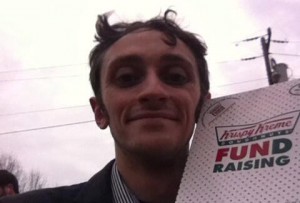 Carolina Connection's Daniel Lane shoots a selfie as he makes his way through a dozen doughnuts at the Krispy Kreme Challenge.