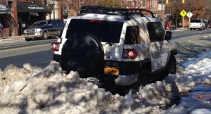 Graduate Student Alec Ginsberg's car remained snowed in on Franklin St. Friday afternoon. (Photo by Zach Mayo)