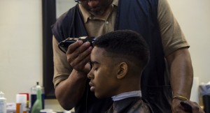  Midway Barbershop has been able to keep bringing people through its doors because of its affordable prices. Despite rent increases, Midway still offers haircuts for ten bucks — eight on Tuesdays — with a little extra charge for your beard. (Photo by Caitlin Kleiboer)