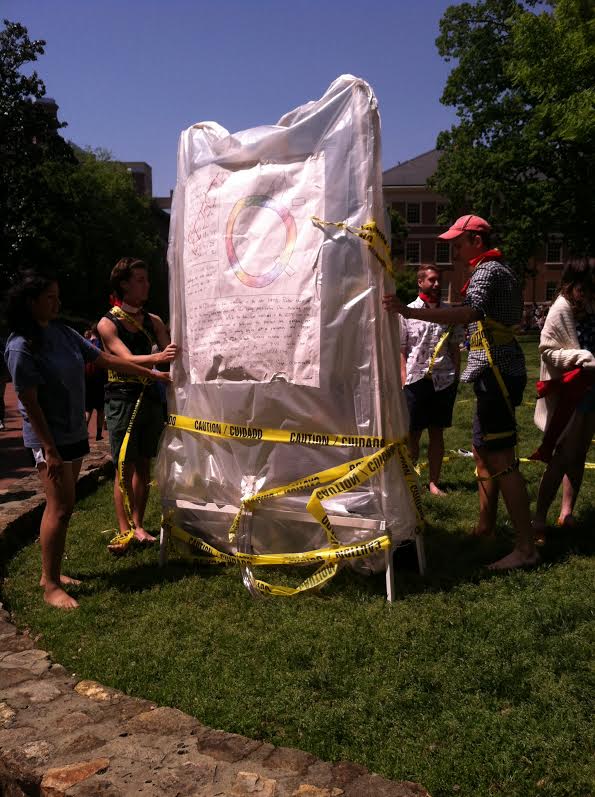 Haig’s blood bag sculpture, made from wire and plastic sheeting, hung in front of UNC’s Wilson Library last month. Several gay men wrapped themselves in caution tape, showing that they were seen as a threat to the blood supply. Photo courtesy of Jessica Coates)