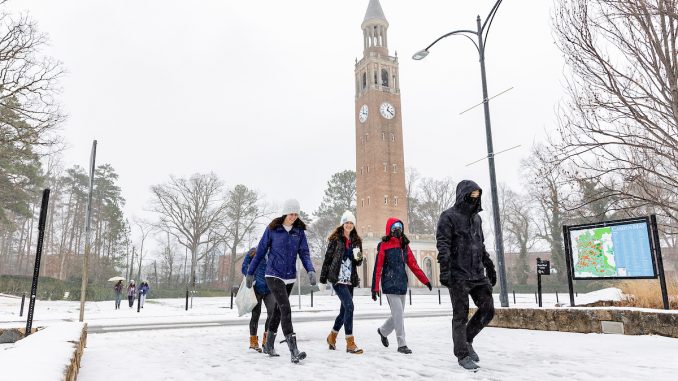 Students walk across campus January 16, a week after UNC began in-person classes for the Spring 2022 semester. (Johnny Andrews/UNC-Chapel Hill)